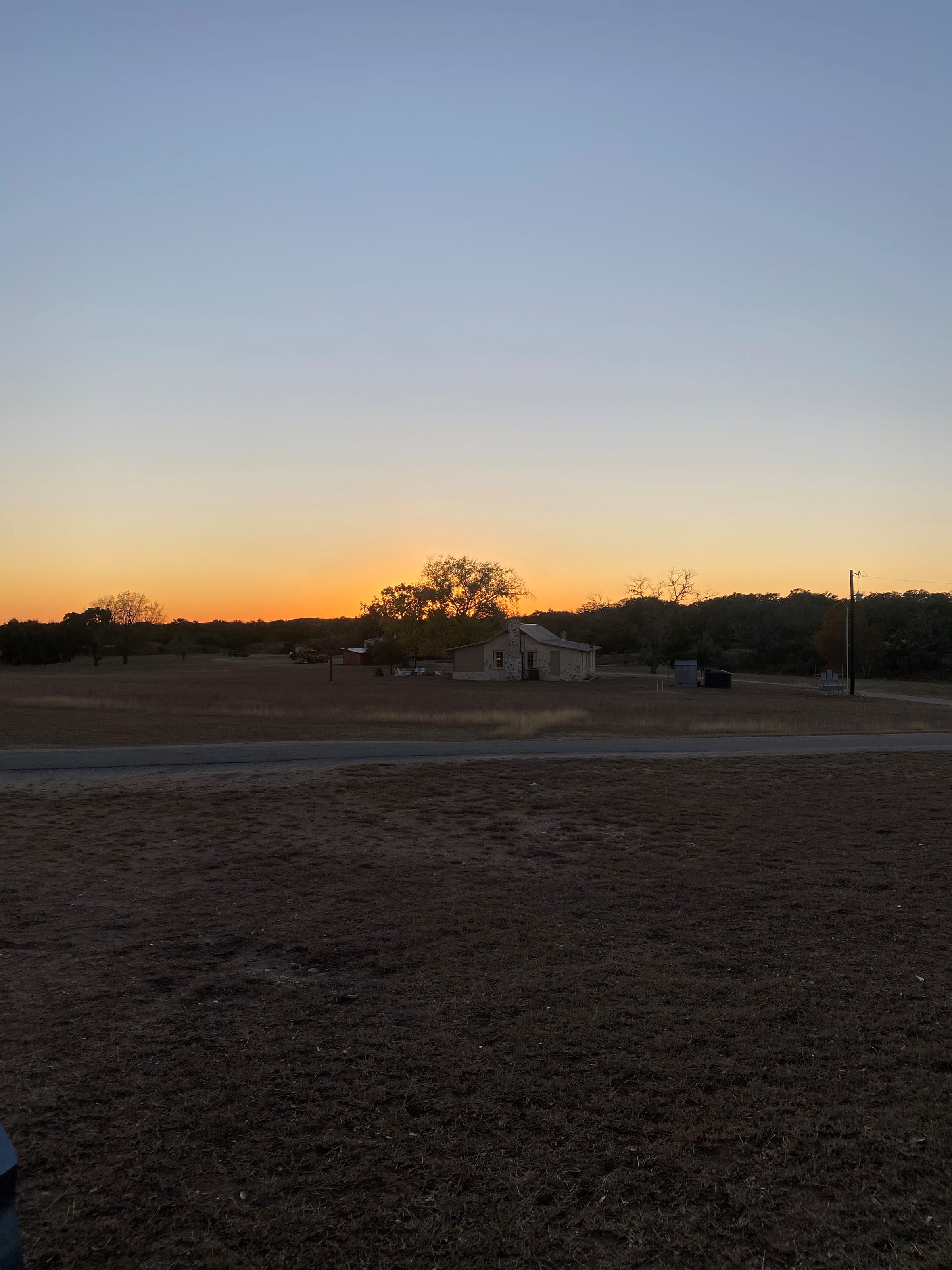 Cottonwood Lodge · sunset over the ranch
