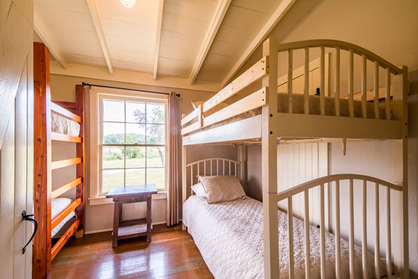 Bunk Room at Cottonwood Lodgege in Pipe Creek, Texas | Rancho Madrono