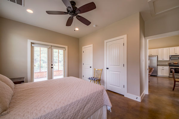 Queen Bedroom with bath at the Creek Cabin, Pipe Creek, Texas