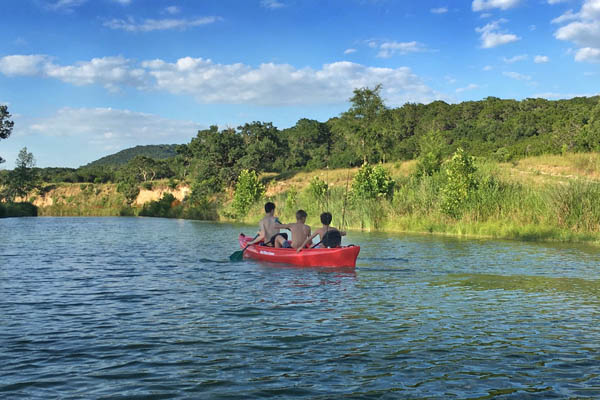 Kayak with 3 Boys in Pipe Creek, near Bandera Texas